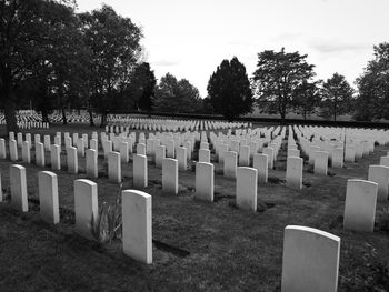 Row of cemetery against sky