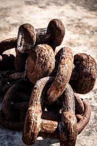 High angle view of rusty chain on land