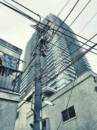 Low angle view of office building against sky