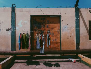 View of built structure with clothes hanging on line