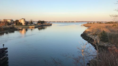 High angle view of river by buildings against sky