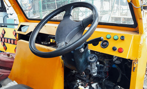 Close-up of yellow motorcycle