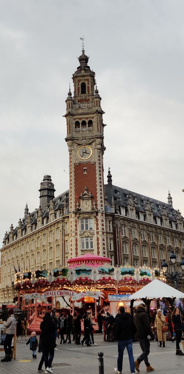 building exterior, architecture, group of people, built structure, sky, large group of people, crowd, real people, city, women, building, tower, adult, men, travel destinations, nature, cloud - sky, tourism, travel, lifestyles, tall - high, outdoors