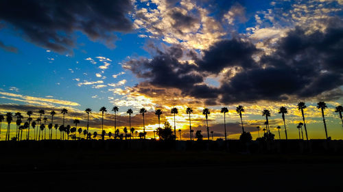 Panoramic view of silhouette landscape against sky during sunset