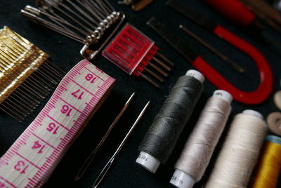 Close-up of sewing kit arranged on table