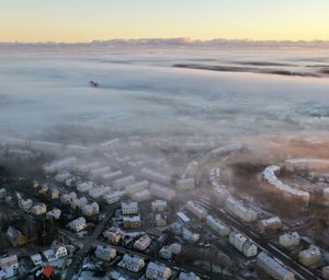 High angle view of city buildings during sunset