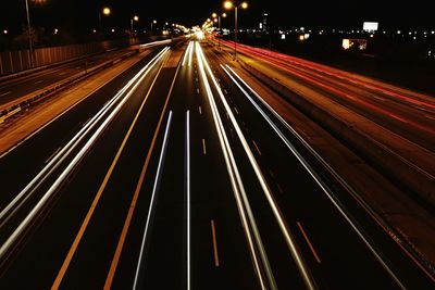 High angle view of light trails on road at night