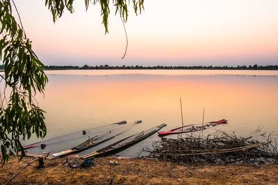 Scenic view of lake against sky during sunset