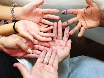 High angle view of cropped friends