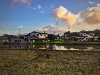 Houses in city against sky