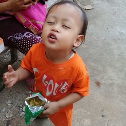 High angle view of cute boy holding baby