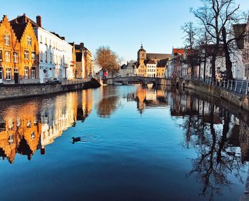 River in old town against clear sky