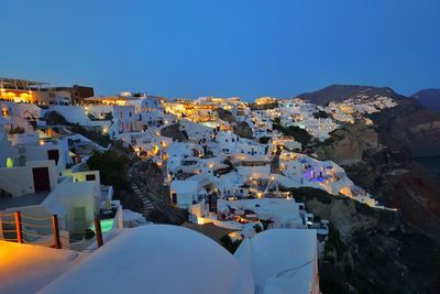 High angle view of townscape against clear blue sky