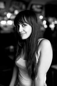 Portrait of a smiling young woman at home