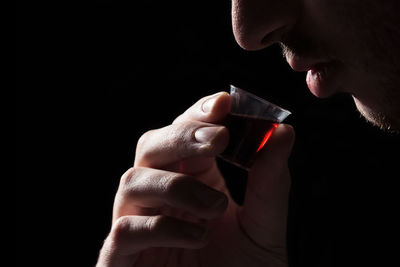 Close-up of woman drinking glass