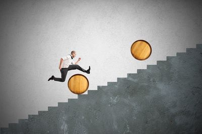 Man jumping in front of building