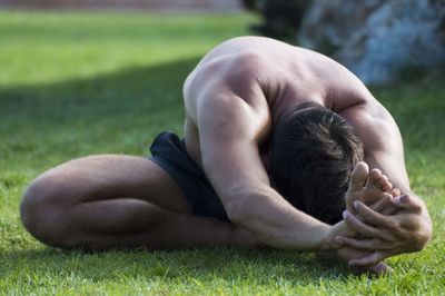 Man lying down on field