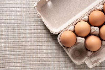 High angle view of eggs in container on table