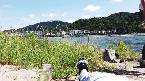 Scenic view of lake against cloudy sky
