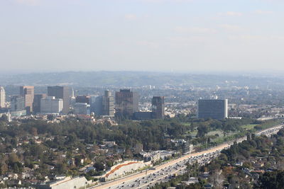 High angle view of buildings in city against sky