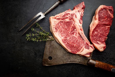 High angle view of food on cutting board against black background