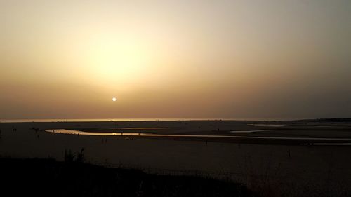 Scenic view of silhouette landscape against sky during sunset