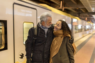 Mature couple on train station platform