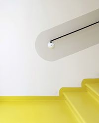 Yellow steps against wall
