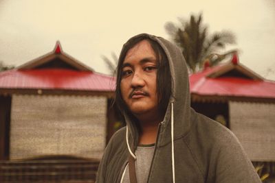 Portrait of mid adult man against sky