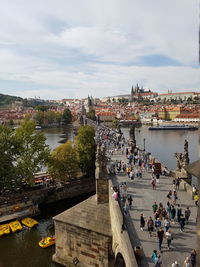 Group of people on bridge over river