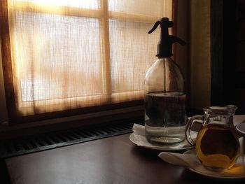 Close-up of soda with drink on table at home