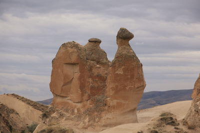 Rock formations on mountain against sky