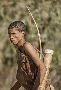 Young man looking away outdoors