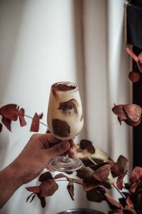 Close-up of hand holding coffee