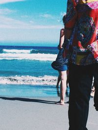 Woman standing on beach