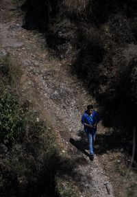 Full length of man walking in forest