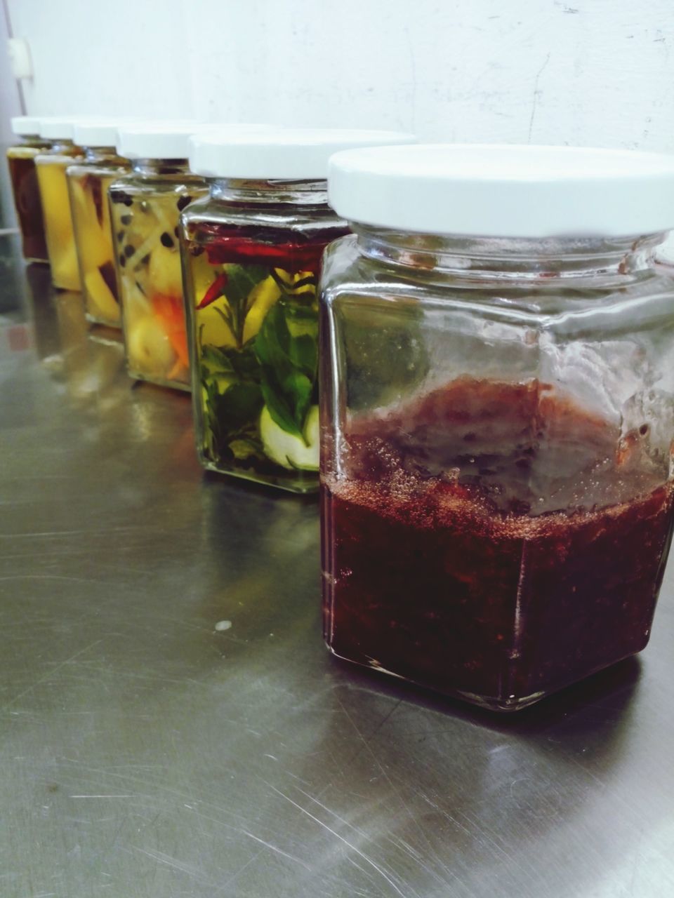 indoors, still life, food and drink, table, glass - material, drink, freshness, close-up, jar, drinking glass, transparent, refreshment, no people, variation, arrangement, red, glass, bottle, food, container