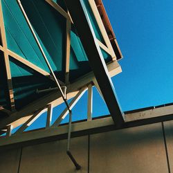 Low angle view of built structure against blue sky