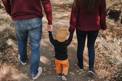 Low section of people standing on road