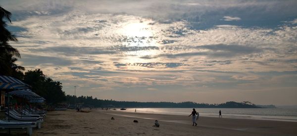Scenic view of beach against sky during sunset