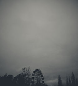 Low angle view of ferris wheel against sky