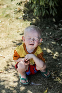 High angle view of cute boy outdoors