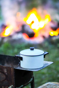 Close-up of tea light candles on metal