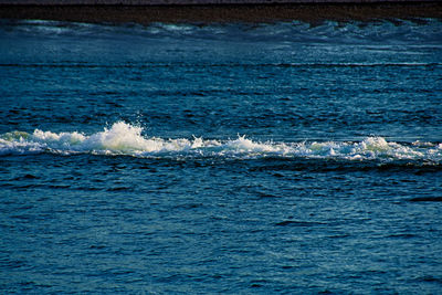 Scenic view of sea against blue sky