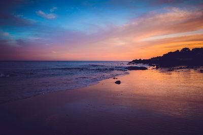 Scenic view of sea against sky at sunset
