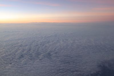 Aerial view of landscape against sky during sunset