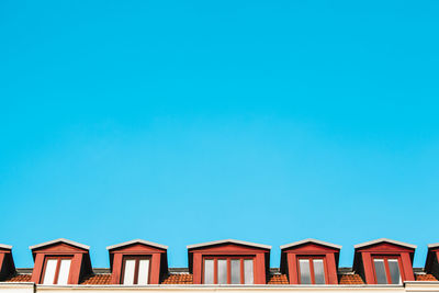 Low angle view of buildings against blue sky