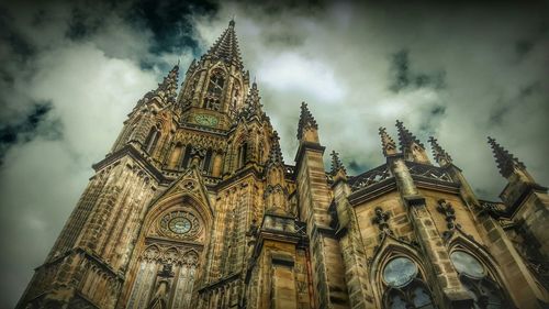 Low angle view of temple against cloudy sky