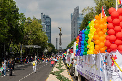 Group of people on road against buildings