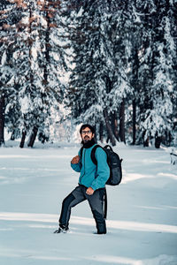 Full length of boy standing on snow